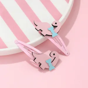 Lot de deux barrettes BB dinosaure rose pour filles avec détail de nœud bleu