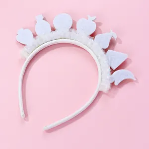White children headband with glittery mesh fruit motifs on soft pink background