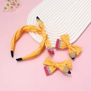 Detailed set of school-themed yellow pencil pattern headband and matching bow hair clips