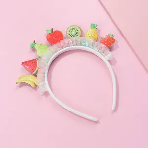 Sweet fruit themed children headband with sequins and white tulle on pink background