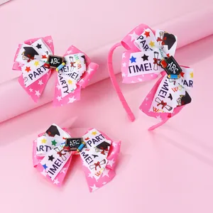 Detail of pink bow headband and clips set with ABC blackboard and school patterns