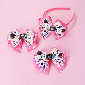 Pink school-themed kids headband and bow hair clips set with academic decorations