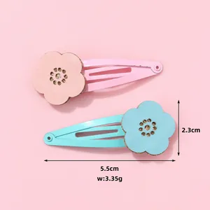 Floral fabric BB hair clips for girls in pink and blue colors set shown from above