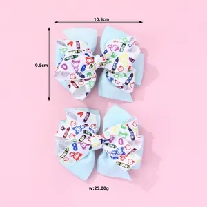 Lot de deux barrettes nœuds bleu clair avec motifs scolaires, nœuds d'école de 10,5 cm