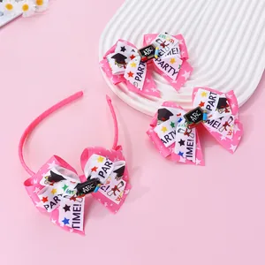 Detail of school-themed bow headband and hair clips with ABC blackboard and scroll patterns