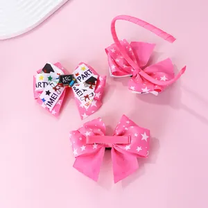 Detailed view of pink ribbon hairbows with star patterns and ABC school theme elements