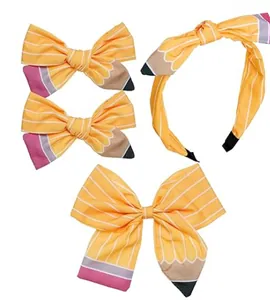 Detail of pencil-themed school hair bows and headband set for girls with creative design