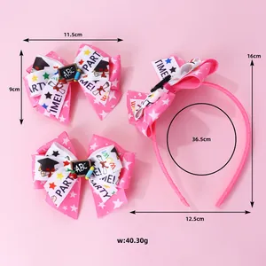 Detail of pink bow headband and clips with graduation patterns and ABC blackboard decor
