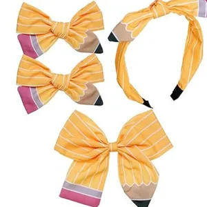 Pencil-themed hair accessories set with yellow bows and a headband for kids school style