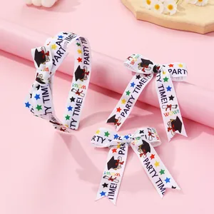 Graduation theme headband and bow set with doctor hat and colorful star patterns
