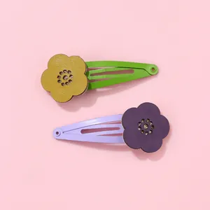 Floral hair clips set featuring yellow and purple leather flowers on colorful BB pins