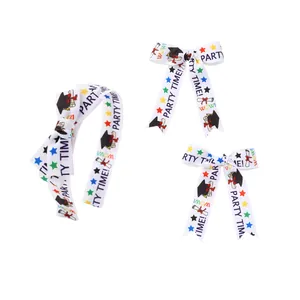 Graduation theme hair accessory set with white ribbon bow headband and two hair clips