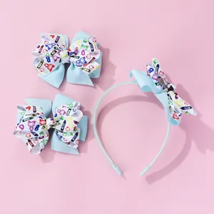 Detail of blue bow hair clips and headband set with colorful doodle crayon patterns