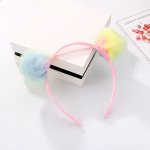Rainbow plush pom-pom headband for girls with soft pastel colors and pink fabric base