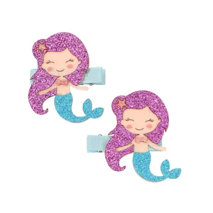 Detail of glitter mermaid hair clips for girls with sequins and blue ribbon-wrapped base