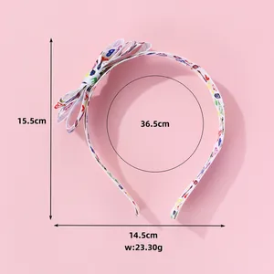 Detailed view of printed fabric bow headband with precise dimensions and weight measurements