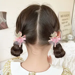 Barrettes fille ballerine rose avec ailes pailletées et tutu en tulle sur cheveux