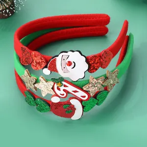 Tre cerchietti natalizi con Babbo Natale, bastoncino di zucchero e paillettes festive