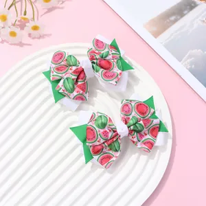 Sweet watermelon print double-layered fabric hair clips for kids on a pink aesthetic background