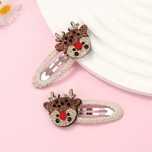Detail of Christmas reindeer hair clips with gold sequins and soft knit fabric wrap
