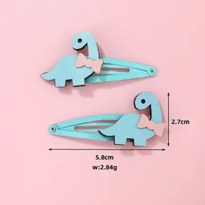 Vue détaillée des barrettes dinosaures bleues de 5,8 cm avec dimensions et poids
