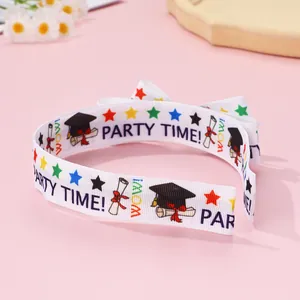 Detail of white graduation headband featuring graduation cap and Party Time lettering
