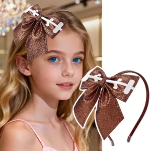 Brown glitter headband for kids with a large bow featuring white stitched patterns