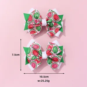 Detail showing dimensions of 10.5cm by 7.5cm for the watermelon pattern bow hair clip