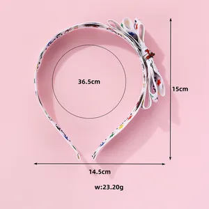 White party bow headband with colorful stars and Party Time print, size 15cm x 14.5cm