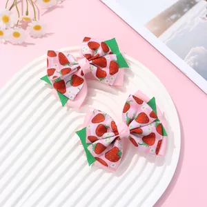 Pink double-layered bow hair clips with strawberry patterns for girls, set of two