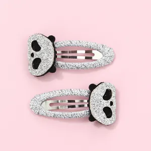 Detail of silver glitter panda hair clips for kids with cute embroidered sequins
