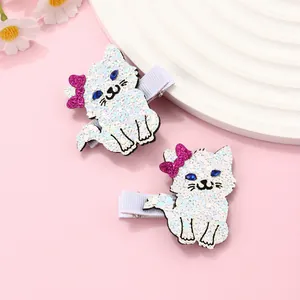 Detail of glitter cat hair clips for girls with sequins and purple bows on pink base