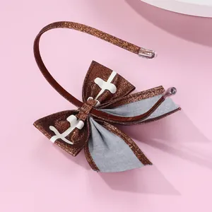 Detailed macro view of American football themed headband with brown glitter fabric texture