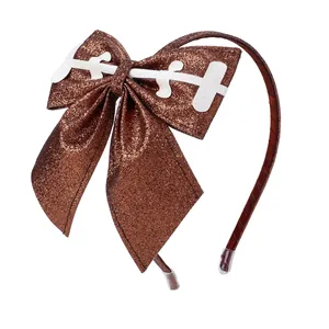 Sparkly glitter American football bow headband with white stitching detail for girls