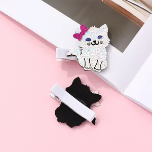 Detailed view of sequined cat hair clips with felt backing and ribbed ribbon alligator clips