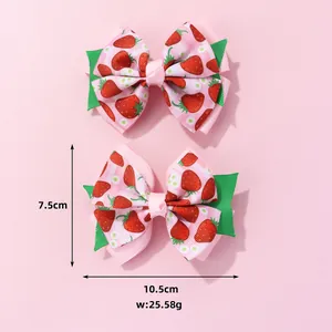 Detailed dimensions of strawberry bow hair clips showing 10.5cm width and 7.5cm height