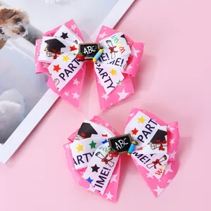 Barrettes à cheveux nœuds rose et blanc avec motifs de remise de diplôme et décor ABC