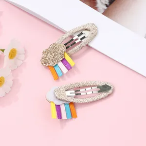 Detail of glitter cloud hair clips with colorful ribbon rainbows for girls