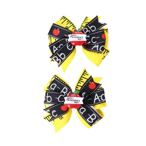 Barrettes à nœuds de style scolaire avec motifs de règle et décors de pommes rouges
