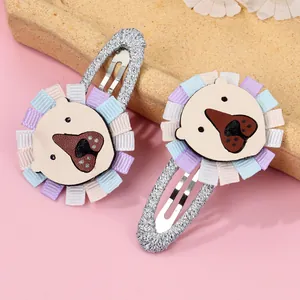 Detail of handmade cartoon animal hair clips with colorful ribbon and metallic fabric
