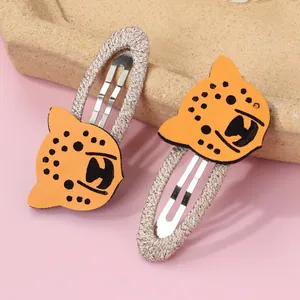 Lot de deux barrettes enfant avec léopard orange et clips BB tressés en argent