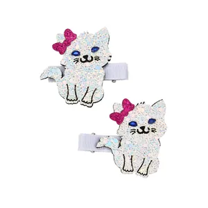 Detail of glitter cat hair clips with pink bows and sequins on metal alligator clips