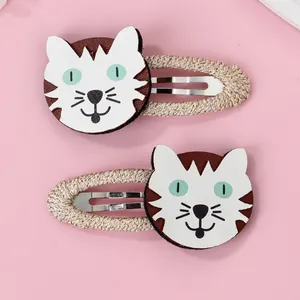 Paire de barrettes chat en similicuir avec bords tressés dorés pour cheveux de fillettes
