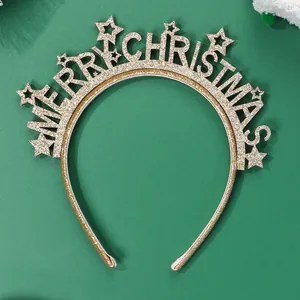 Flat lay of Merry Christmas gold glitter headband with stars on green background