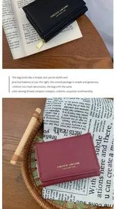Detailed view of Saffiano leather texture and exquisite golden lettering on slim wallets