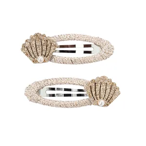 Glittering shell hair clips with pearl detail and woven fabric wrapped drop pins