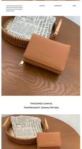 Detail of saffiano textured brown wallet with Forever Sunshine text and metal zipper