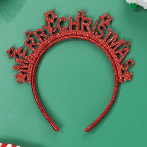 Detail view of red glitter Merry Christmas headband with star design on green background