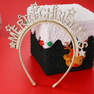 Detail of glittery gold Merry Christmas headband with star accents for holiday party wear