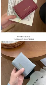 Detail of cross-grain leather Saffiano wallet with gold lettering in stylish colors